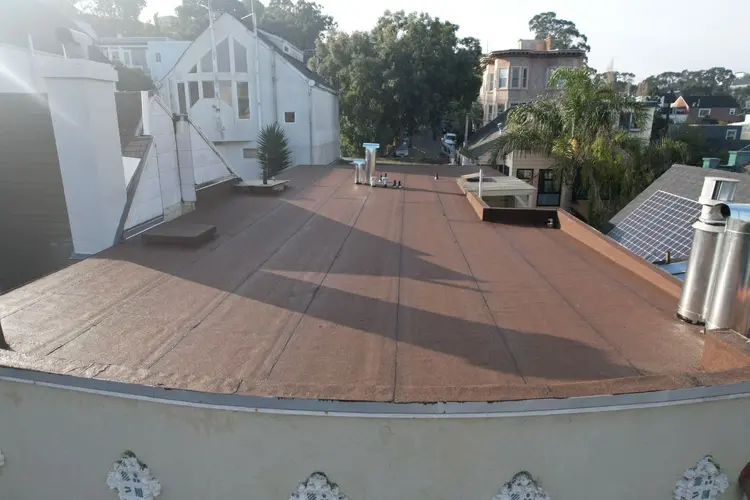 San Francisco roofer sealing seams of a flat roof with modified bitumen material
