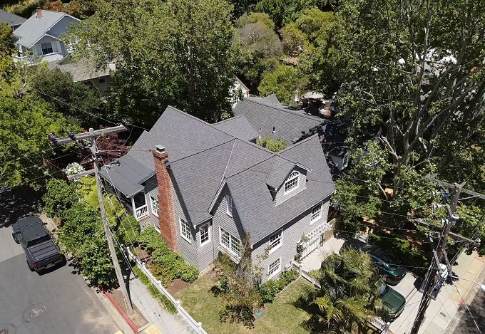 gray roof car wires trees